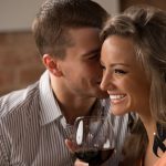 Young happy couple having romantic date at restaurant